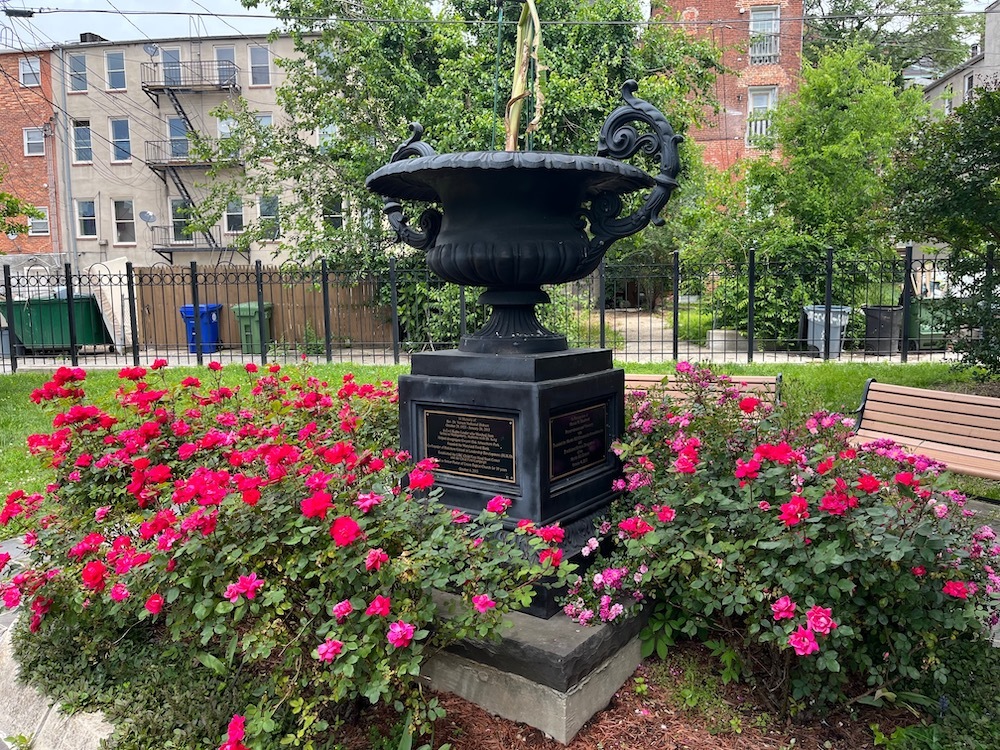 Memorial urn surrounded by flowers