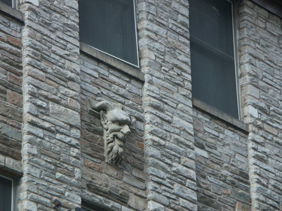 The carved figure on 214 East Lexington St