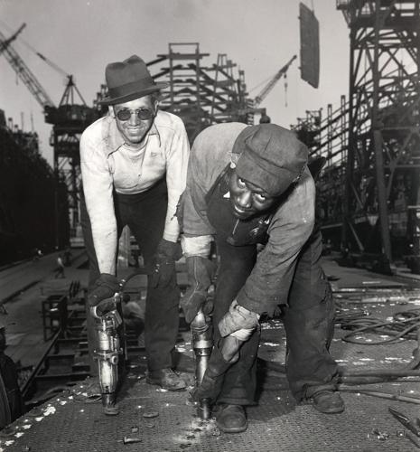 Two workers at Sparrows Point during WWII
