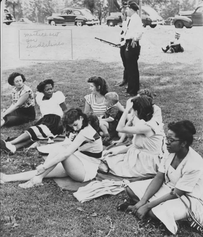 Spectators in Druid Hill Park, while police arrive to stop the interracial match on July 11, 1948.