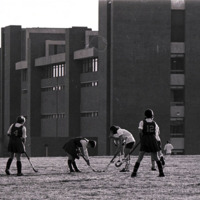 Women's Field Hockey game on the Library field